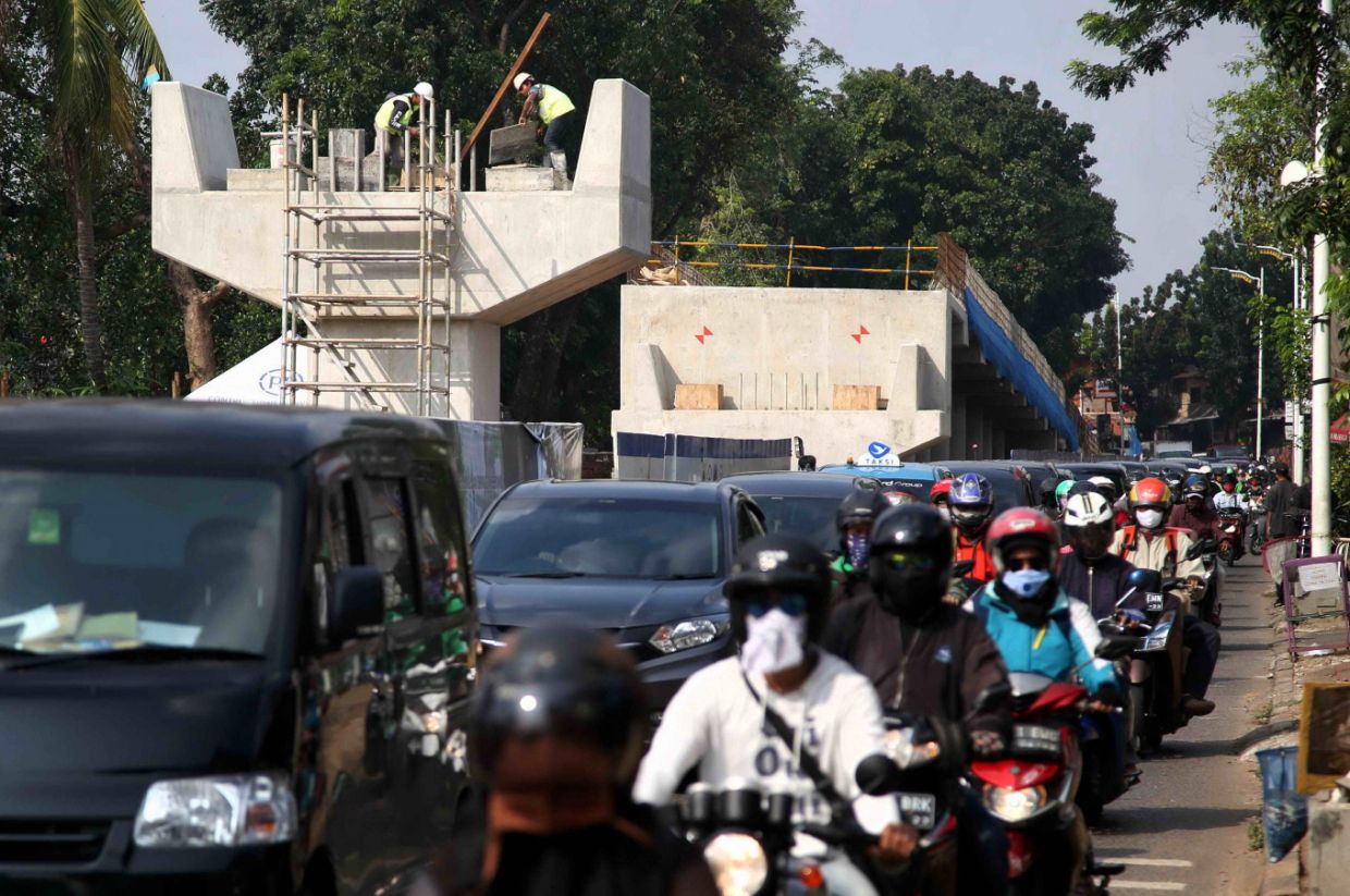Indonesia to evaluate partial lockdown as companies, factories defy orders
